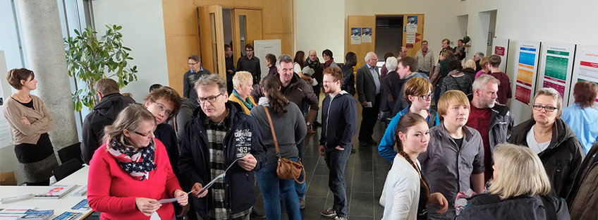 many people at an event in the entrance hall