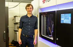 First-author Dr. Alexander Belyy in front of the Talos Arctica Cryo-TEM.